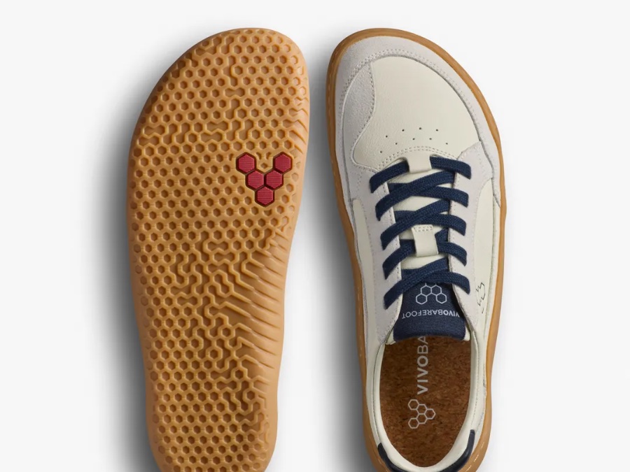 A Vivobarefoot Gobi III sneaker next to its sole, showing the wide toe box